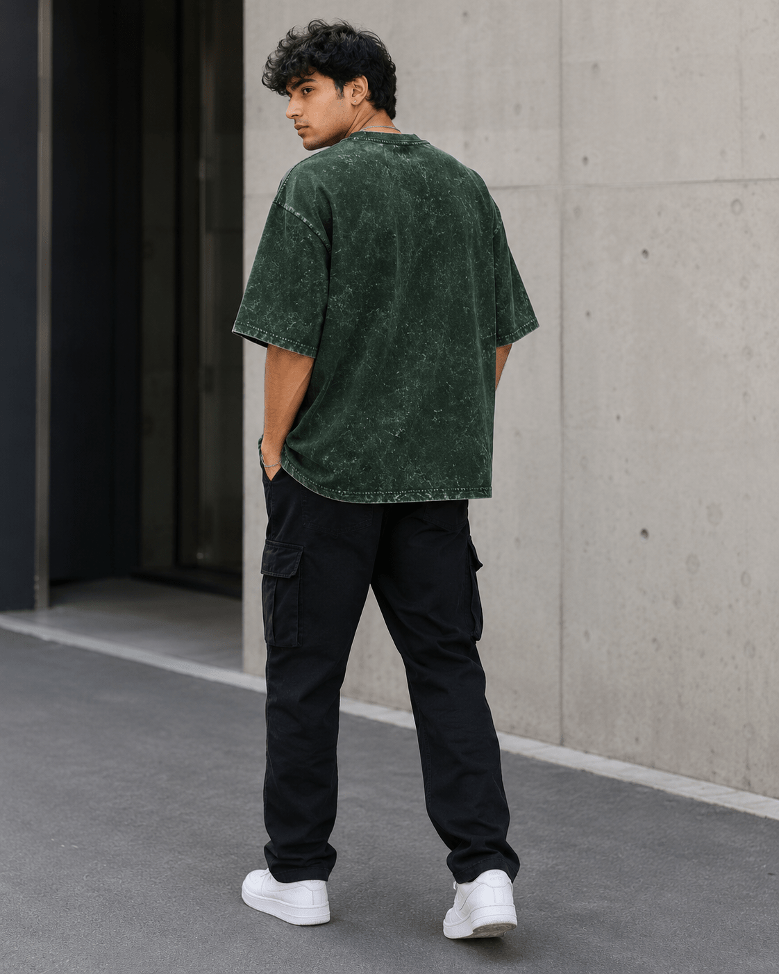Male model wearing Bottle Green Acid Washed Oversized Tee back view