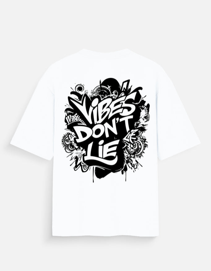White oversized t-shirt showing Vibes Don’t Lie black graphic print on the back.