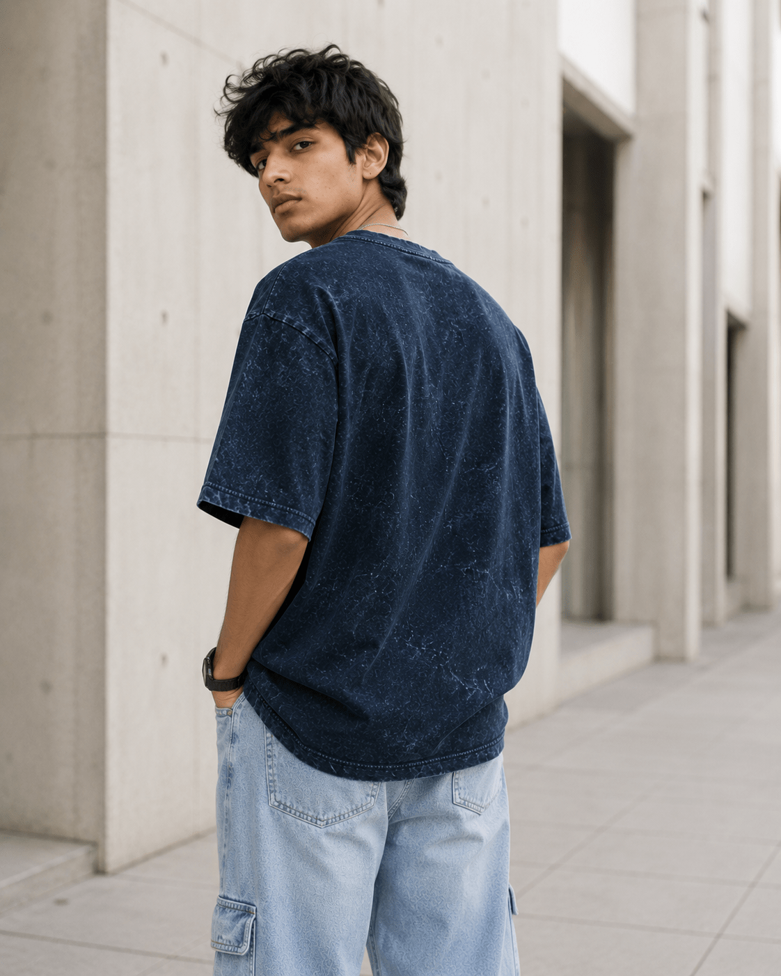 Male model wearing Navy Blue Acid Washed Oversized Tee back view