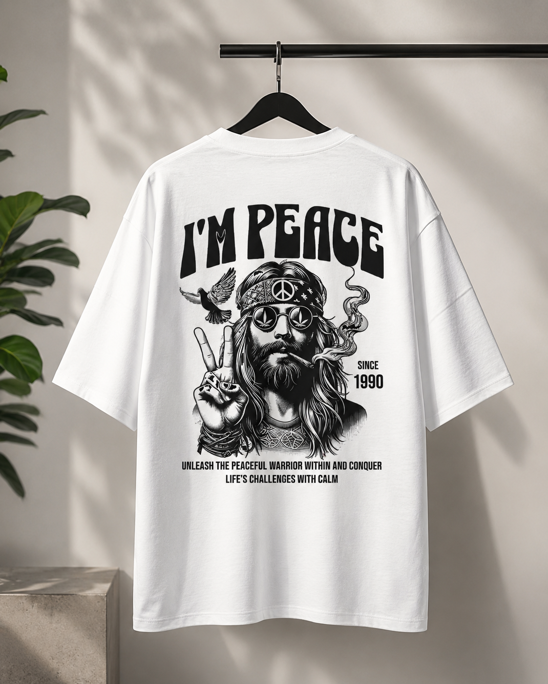 Peace Oversized T-Shirt in white hanging on a black hanger with bold black back graphic print.