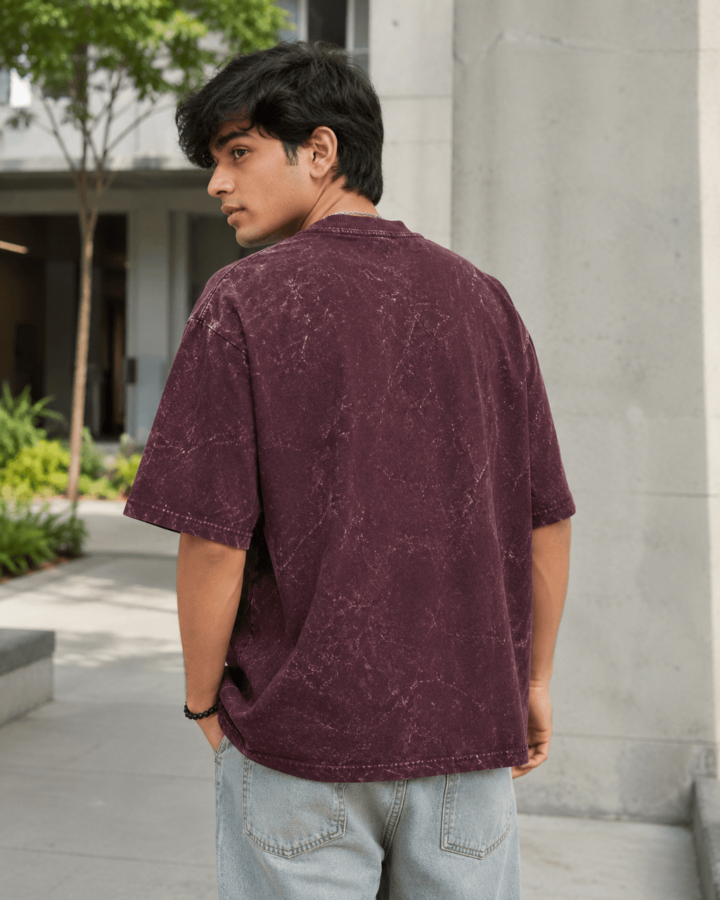 Male model showing back of Maroon Acid Washed Oversized Tee